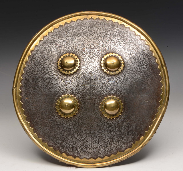 Appraisal: AN INDIAN DECCAN CIRCULAR STEEL SHIELD with engraved decoration and