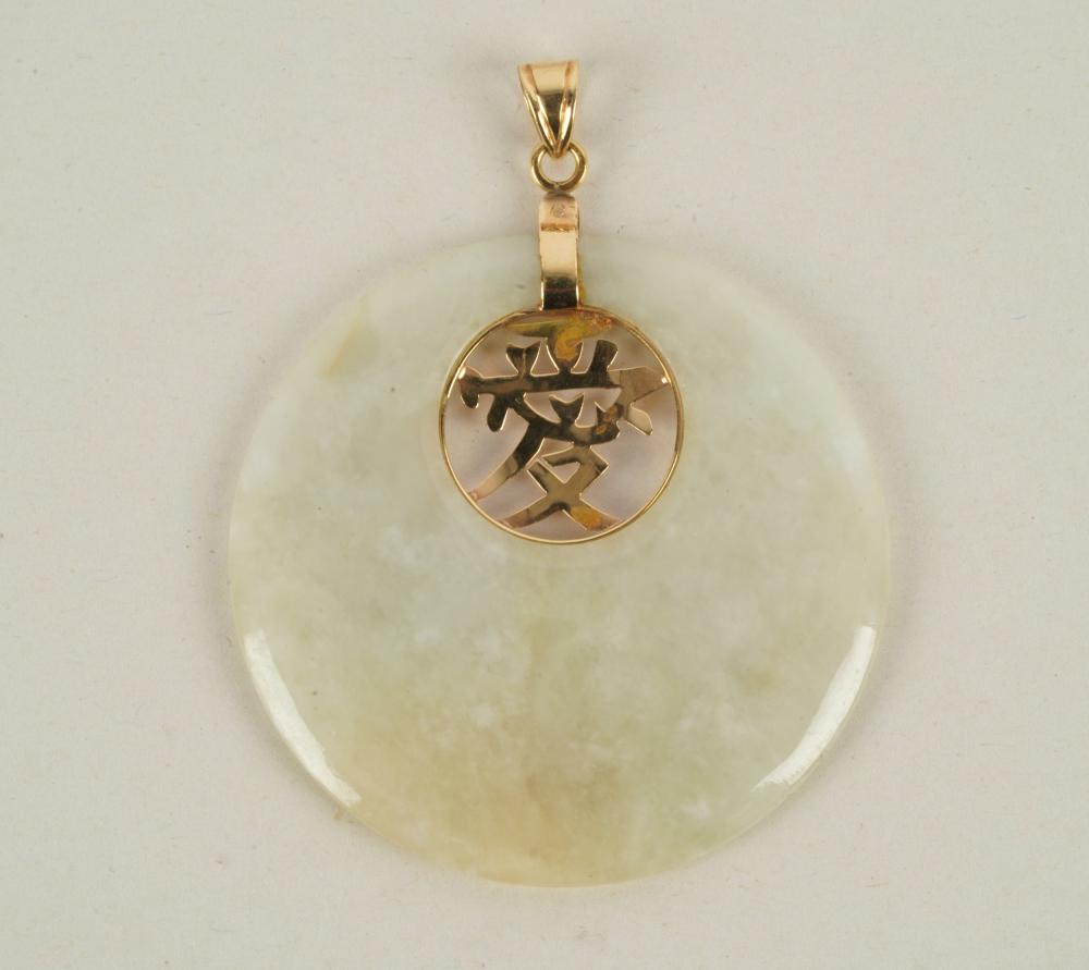 Appraisal: KARAT YELLOW GOLD JADE PENDANTcontaining one pierced round white jade