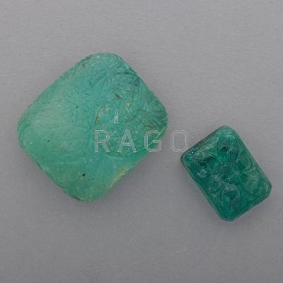 Appraisal: TWO UNMOUNTED INDIAN CARVED EMERALDS Cushion-shapes with foliate design cts