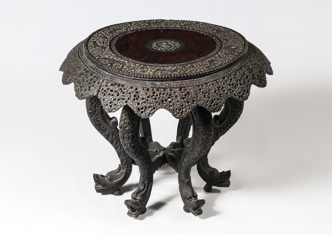 Appraisal: CARVED BURMESE CENTER TABLE Round tope with intricately carved trim