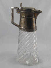 Appraisal: A silver plate mounted cut glass claret jug the oval