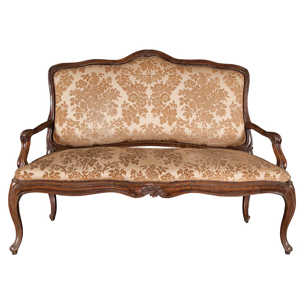 Appraisal: Italian Rococo Walnut Settee The shaped inset backrest within a