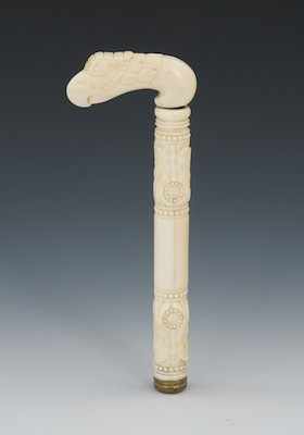 Appraisal: A Victorian Carved Ivory Walking Stick Handle A detailed carving