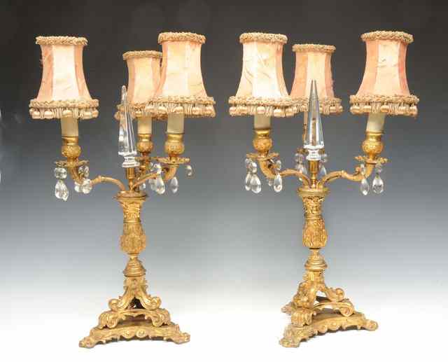 Appraisal: A PAIR OF ORMOLU THREE BRANCH CANDELABRA with central pointed