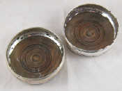 Appraisal: A pair of silver coasters London