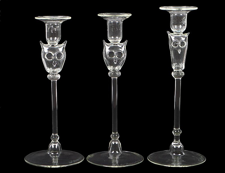 Appraisal: THREE COLORLESS BLOWN GLASS CANDLESTICKSSigned and dated Brunswieg Each circular