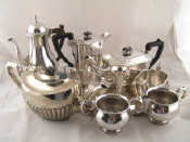 Appraisal: Silver plate A four piece teaset another teapot coffee pot