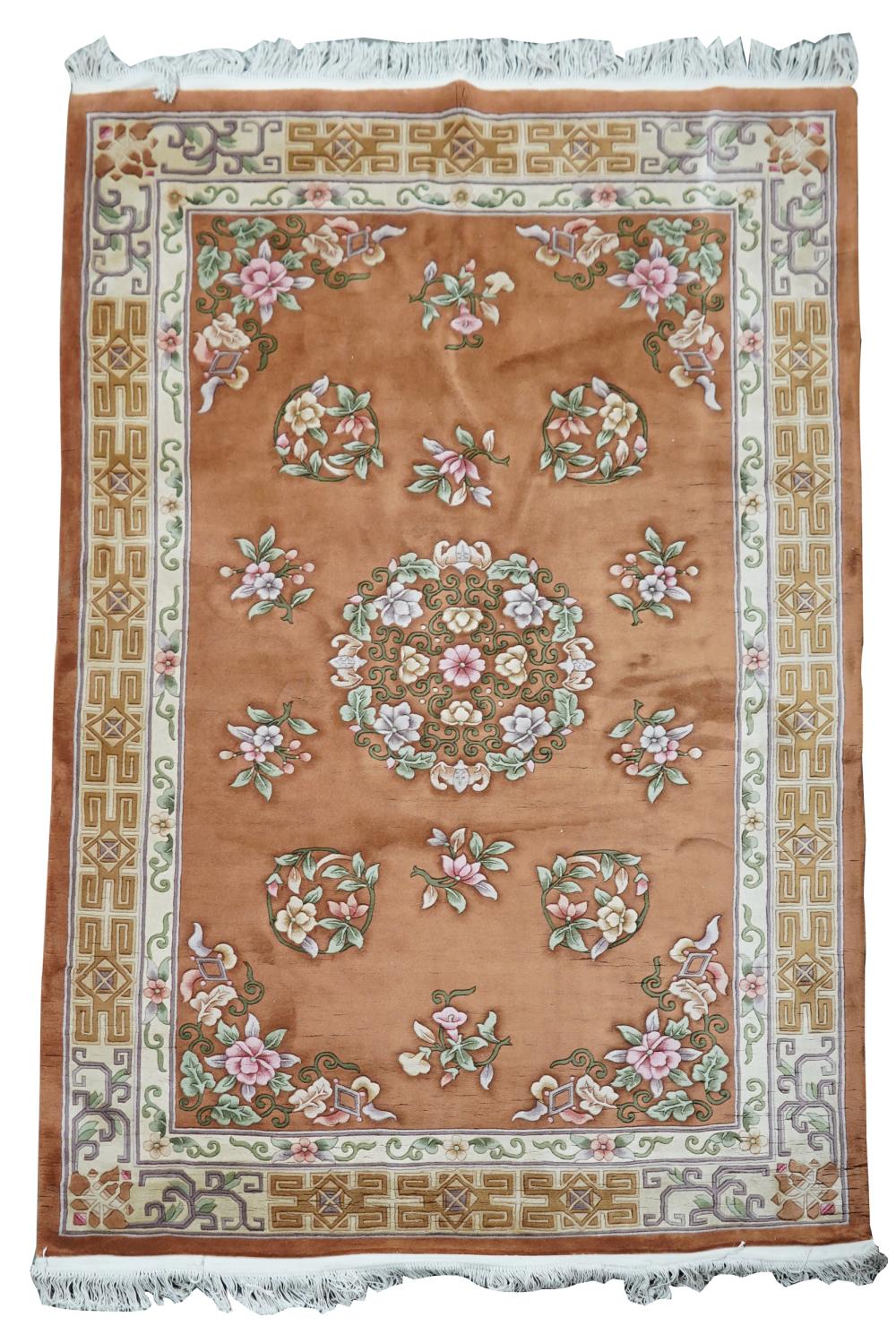 Appraisal: CHINESE FLORAL RUGwool on cotton foundation with rust-colored field '