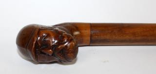 Appraisal: Antique carved walnut cane with POW Antique walnut cane with