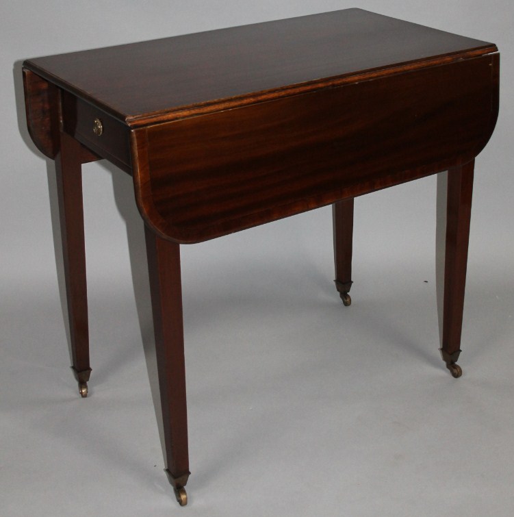 Appraisal: A mahogany Pembroke table the cross banded top with an