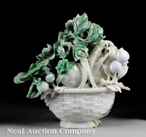 Appraisal: A Chinese Carved Jadeite Basket of Fruit and Flowering Branches