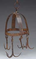 Appraisal: WROUGHT IRON HANGING MEAT CROWN Strap helmet shaped crown holding