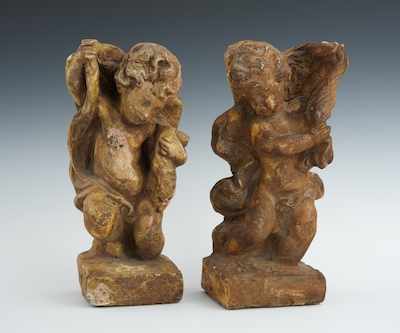 Appraisal: A Pair of Mirror Image Putti Cast terracotta figures with