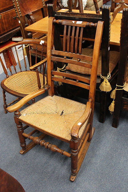 Appraisal: AN OLD RUSH SEATED ROCKING CHAIR with turned supports