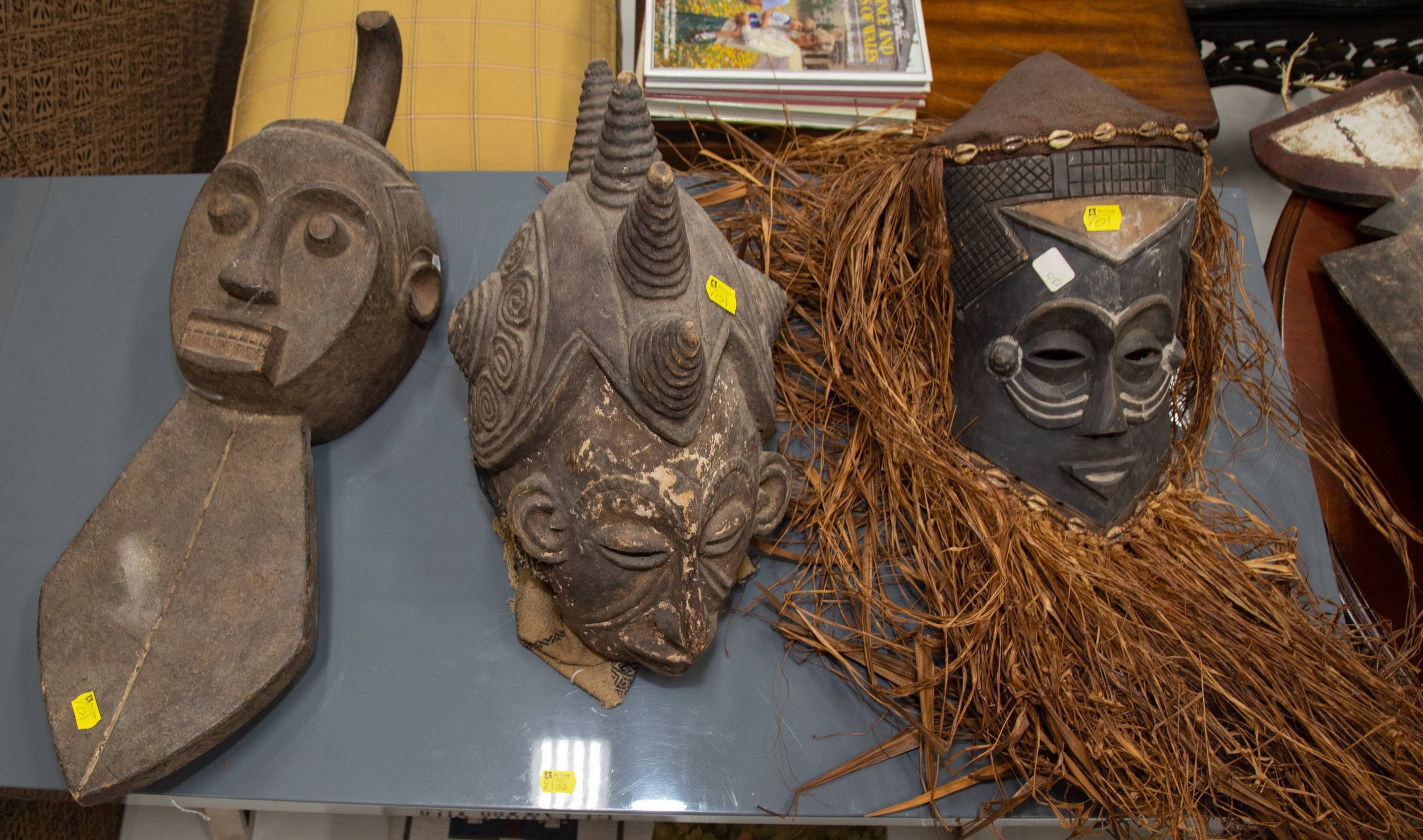 Appraisal: THREE AFRICAN CARVED WOOD MASKS th century including an Igbo