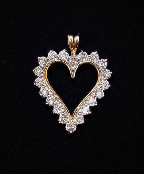 Appraisal: DIAMOND HEART PENDANT K yellow gold diamond heart shaped pendant