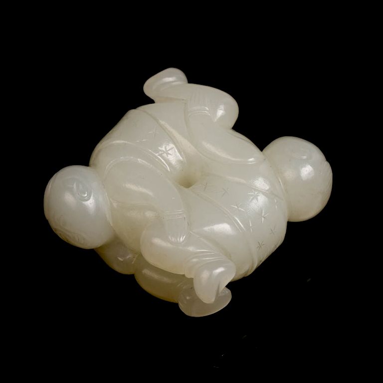 Appraisal: JADE CARVING TOGGLE stone of an even white tone depicts