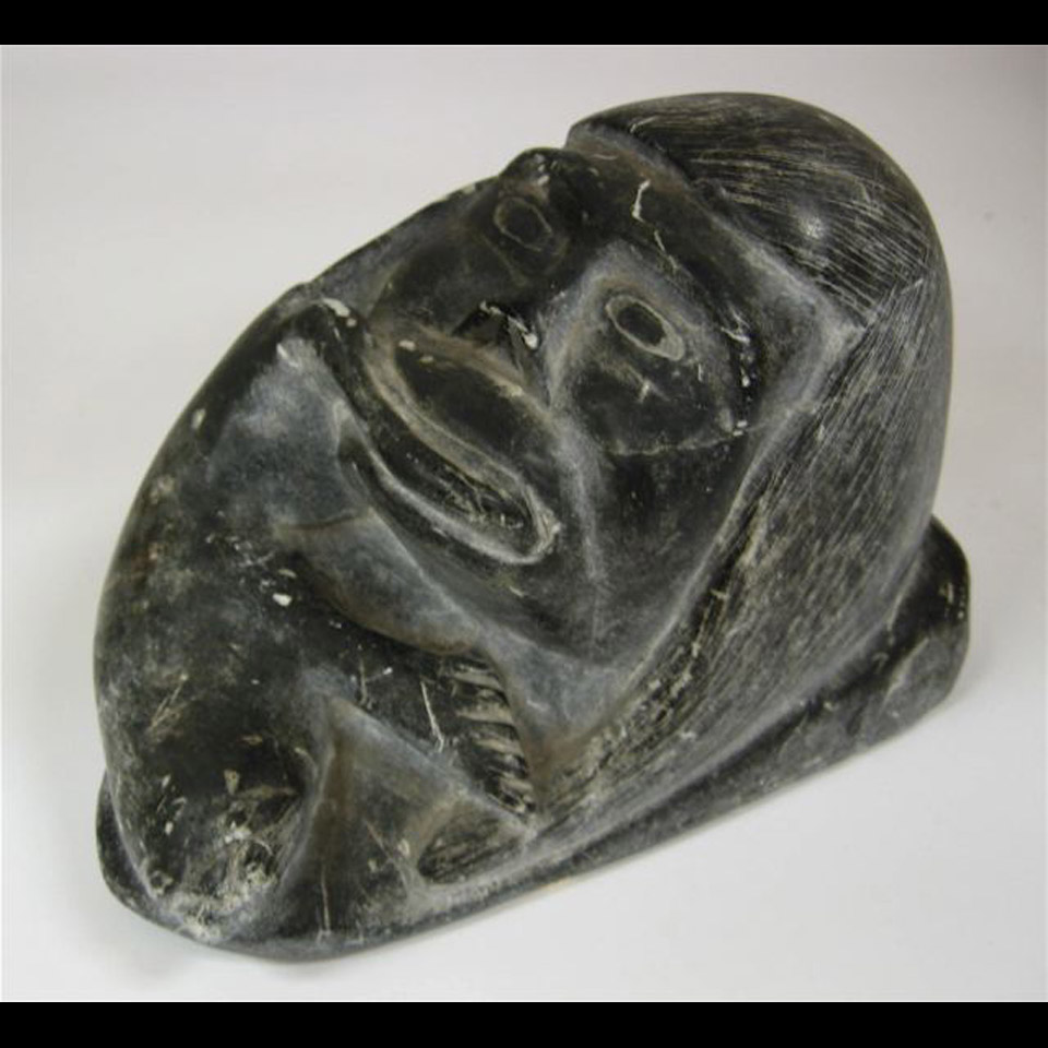 Appraisal: INUIT HUNTER WITH SEAL IN MOUTH SOAPSTONE CARVING - X