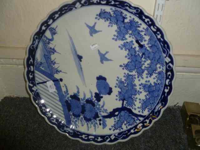 Appraisal: A JAPANESE BLUE AND WHITE CHARGER with floral decoration and