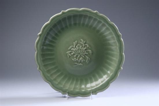 Appraisal: CHINESE CELADON PORCELAIN BARBED CHARGER Ming Dynasty The center molded