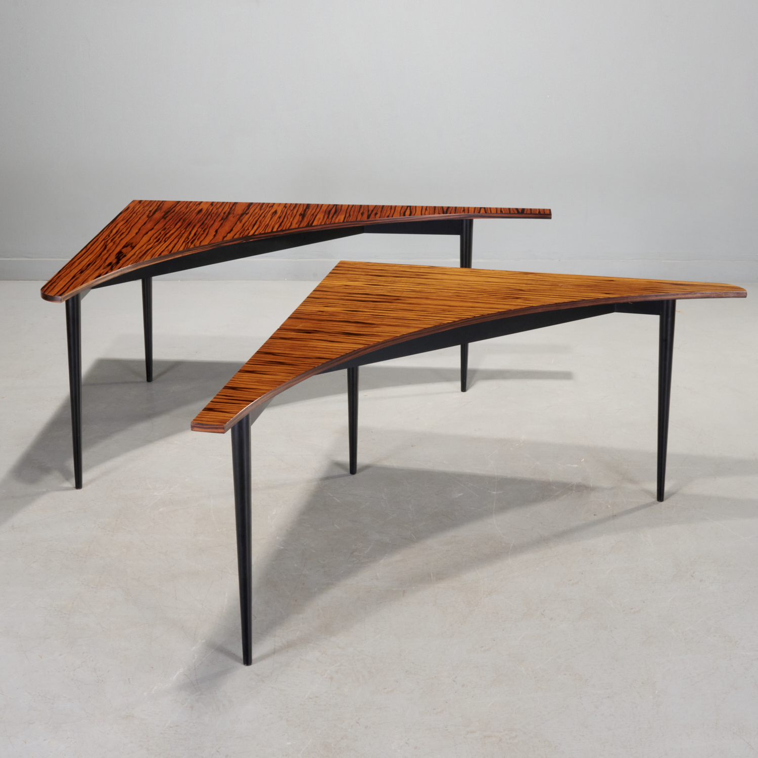 Appraisal: HARVEY PROBBER MACASSAR CORNER TABLES c s USA Macassar ebony