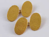 Appraisal: A pair of carat gold cufflinks with hammered effect finish