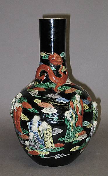 Appraisal: A famille noire enameled porcelain stick neck vase Kangxi Mark