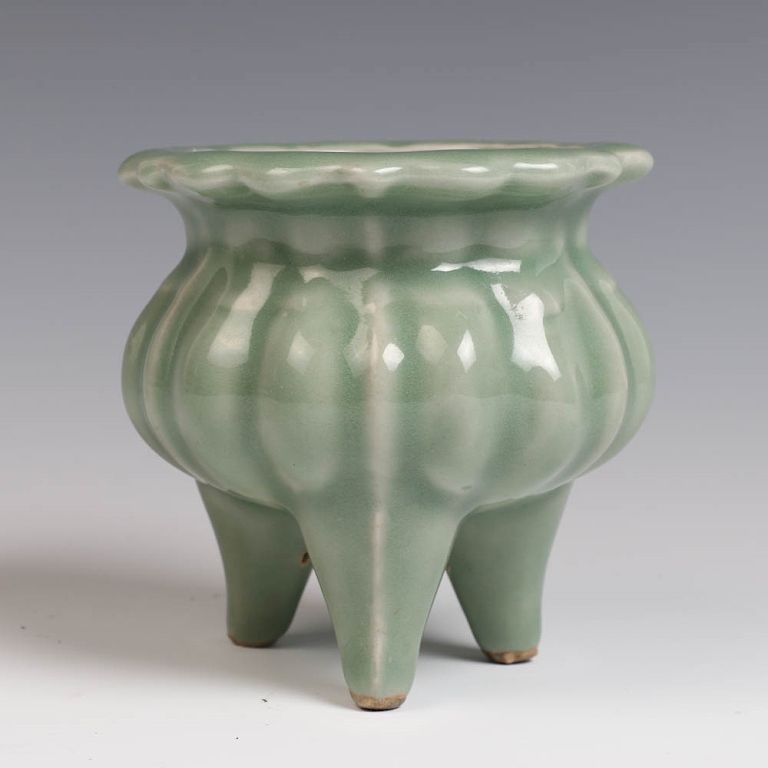 Appraisal: LONGQUAN CELADON TRIPOD CENSER TH CENTURY the compressed body has