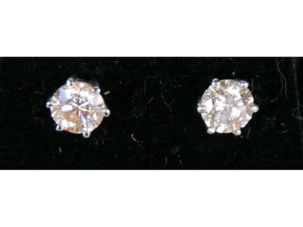 Appraisal: PAIR OF SOLITAIRE DIAMOND STUD EARRINGS each approx ct