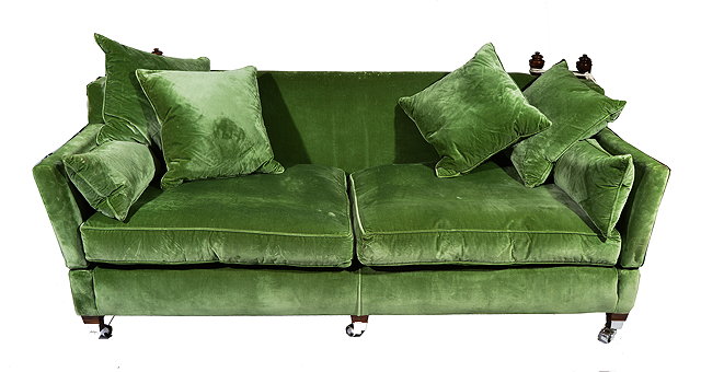 Appraisal: A GREEN UPHOLSTERED KNOWLE TYPE DROP END SOFA standing on