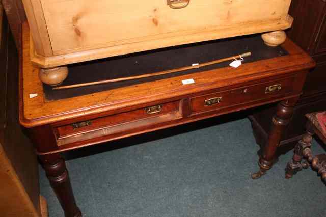 Appraisal: A VICTORIAN MAHOGANY WRITING TABLE fitted with two frieze drawers