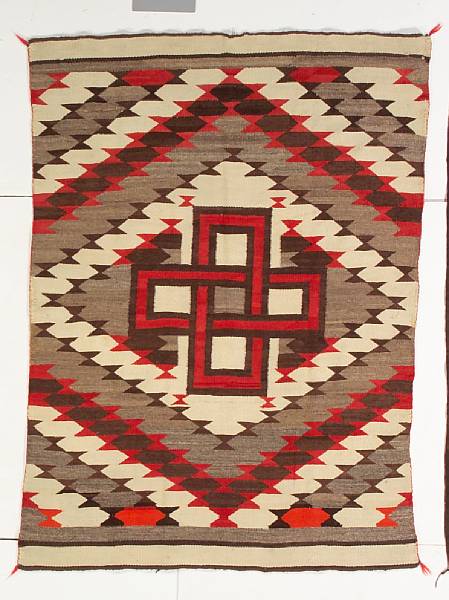 Appraisal: A Navajo transitional rug Centering a cross motif on the