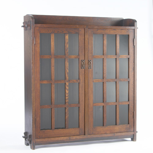 Appraisal: ONONDAGA SHOPS Two-door bookcase with twelve panes and copper pulls