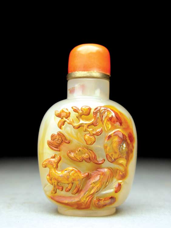 Appraisal: CAMEO AGATE SNUFF BOTTLE Very finely hollowed cameo carved agate