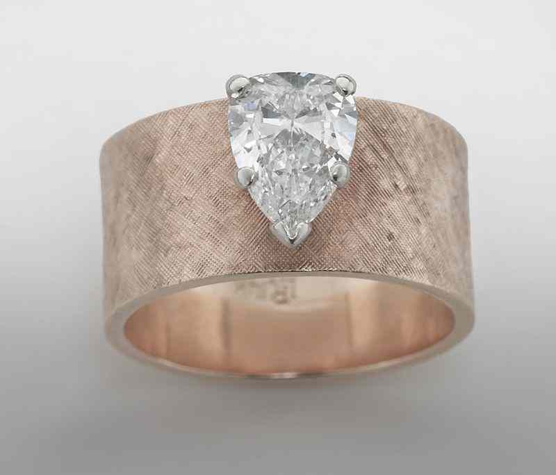 Appraisal: K gold and pear shaped diamond ring the marquise cut