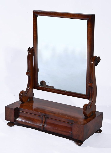 Appraisal: A VICTORIAN MAHOGANY SWING TOILET MIRROR with scroll frame cm