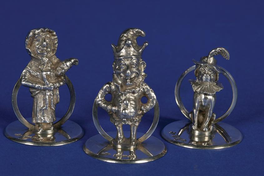 Appraisal: A SET OF THREE NOVELTY MENU CARD HOLDERS modelled in