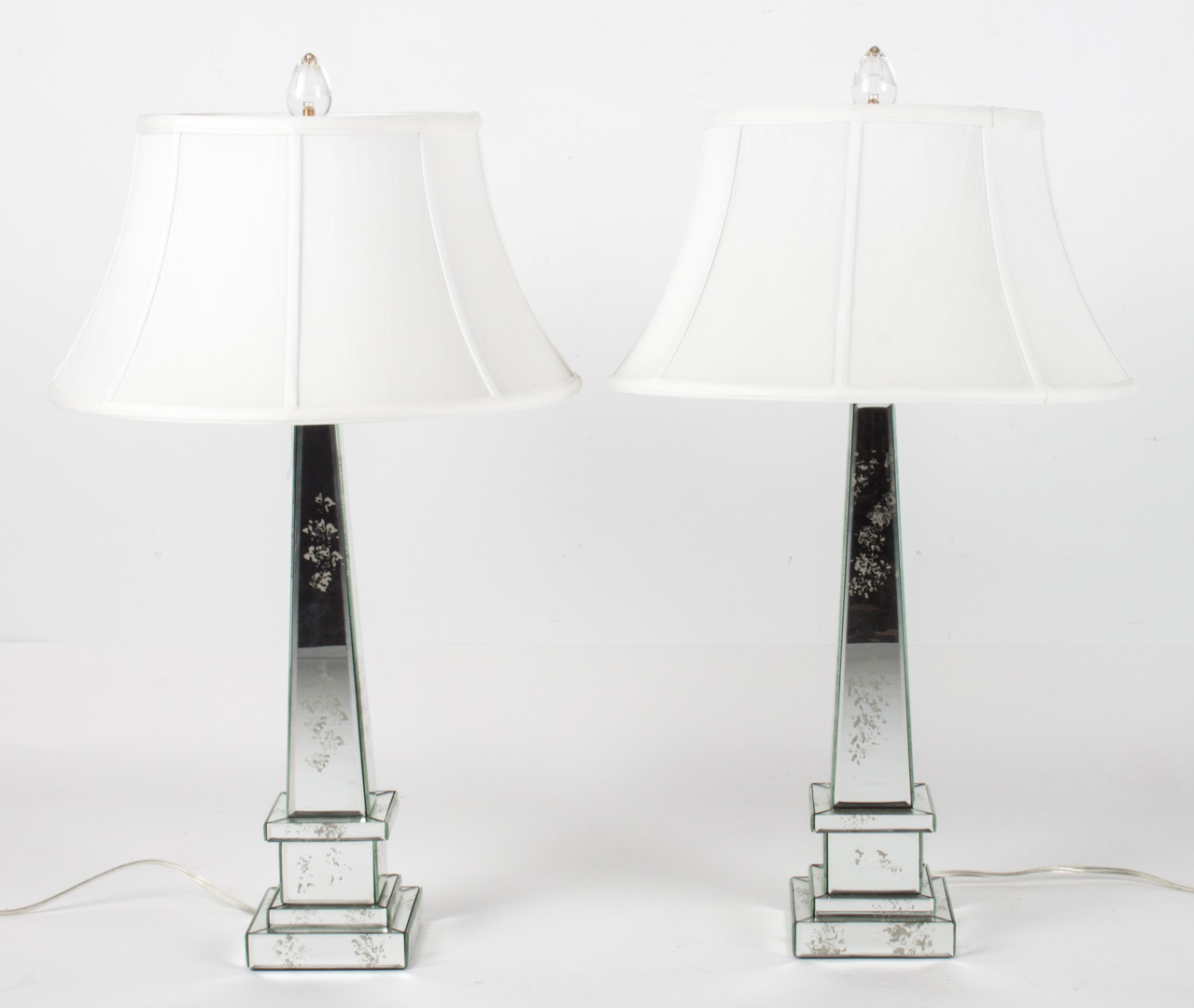 Appraisal: Pair of contemporary mirrored glass lamps obelisk form covered with