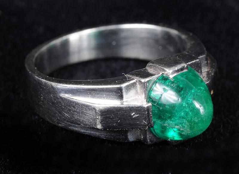 Appraisal: PLATINUM AND CABOCHON EMERALD RING Emerald approx cts with hairline