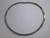 Appraisal: A stainless steel collar necklace with yellow metal tests carat