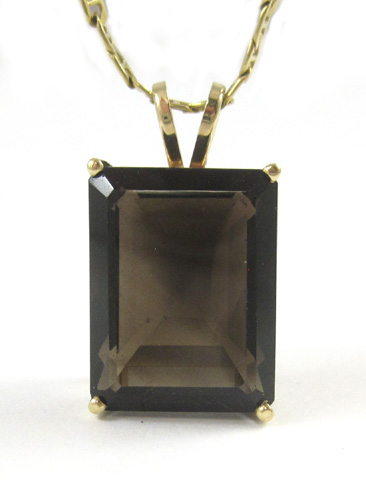 Appraisal: SMOKY QUARTZ AND YELLOW GOLD PENDANT NECKLACE suspended on an