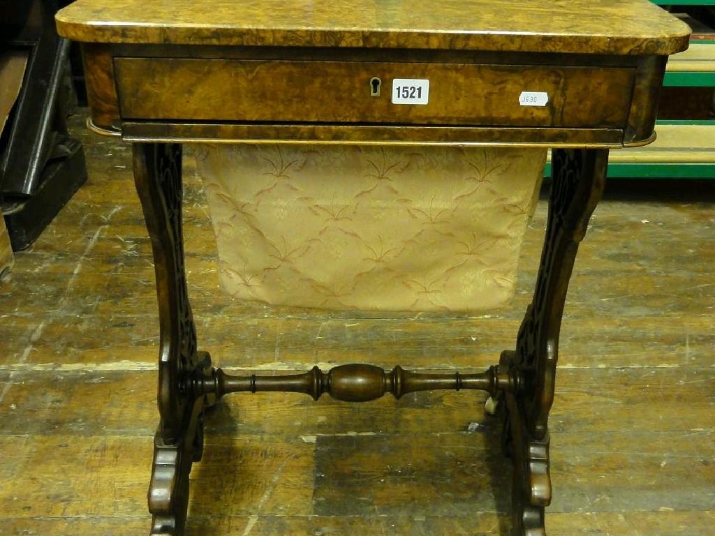 Appraisal: A walnut figured and burr walnut veneered sewing work table