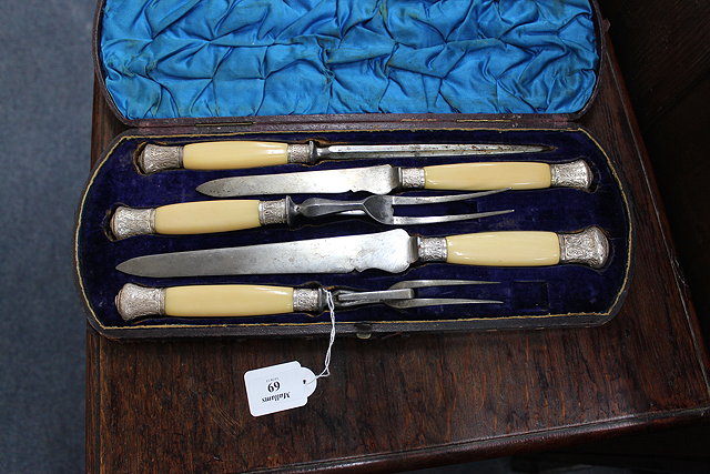 Appraisal: A TH CENTURY CARVING SET with ivory and silver mounted