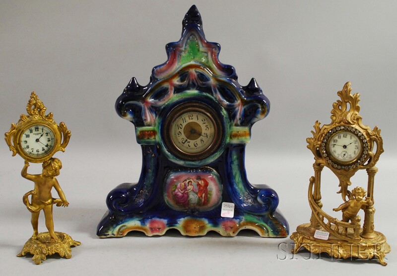 Appraisal: English Glazed Ceramic Cased Mantel Clock and Two Gilt-metal Cherub