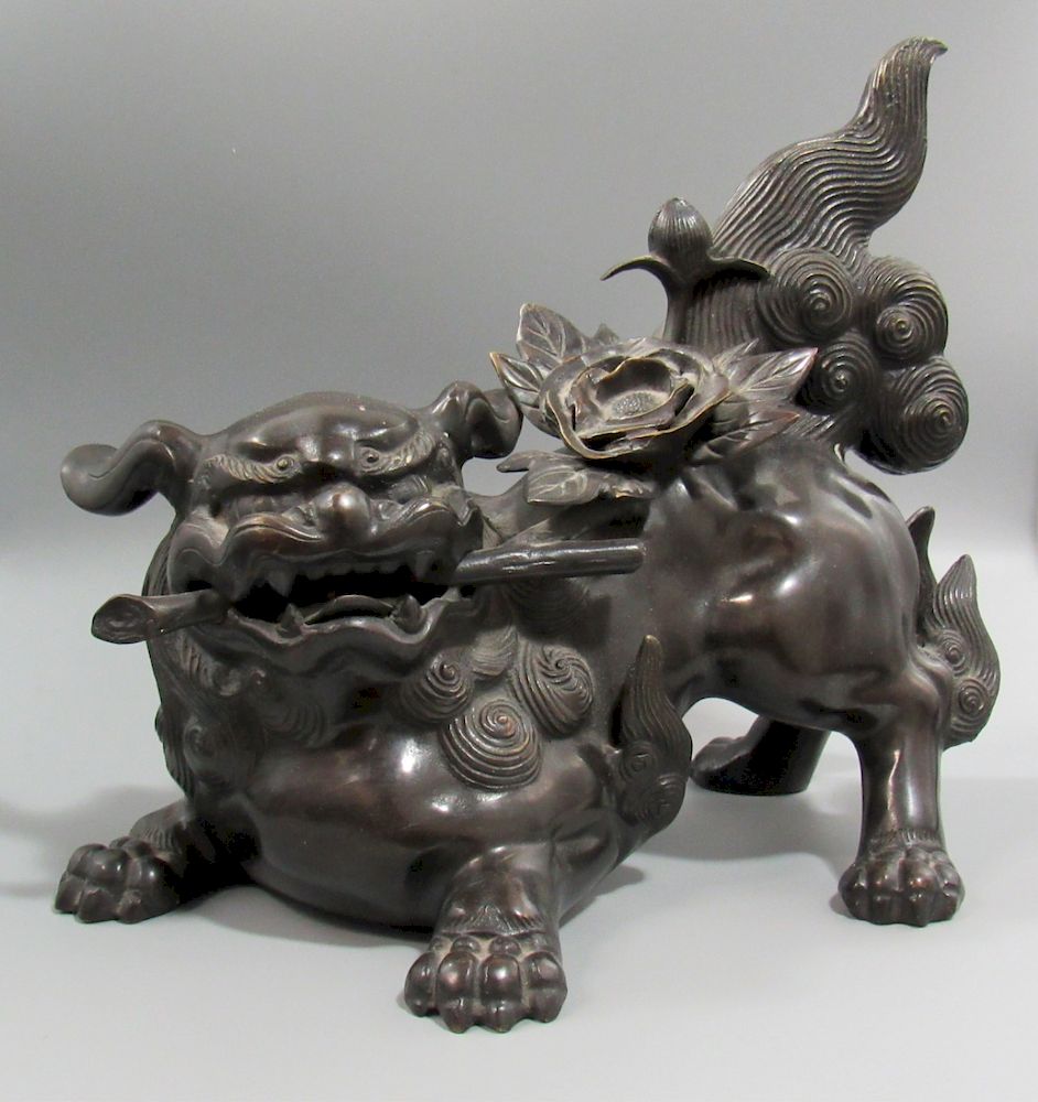 Appraisal: Japanese Bronze Foo Dog Signed Shoun The dog crouches playfully