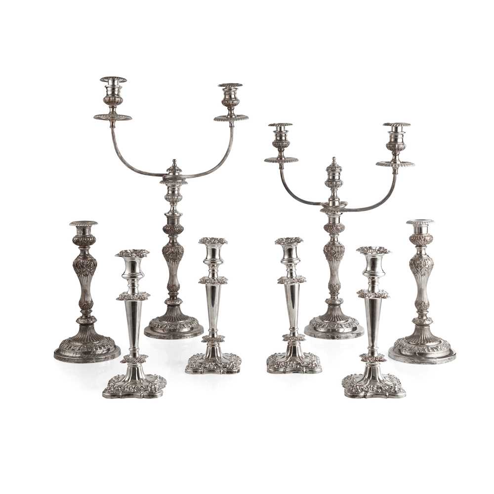 Appraisal: A SUITE OF FOUR TABLE PLATED CANDLESTICKS plate on copper