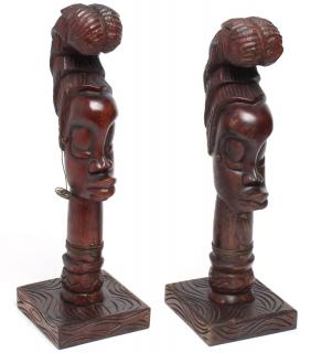 Appraisal: Pair of African Hand The females with elongated features signed