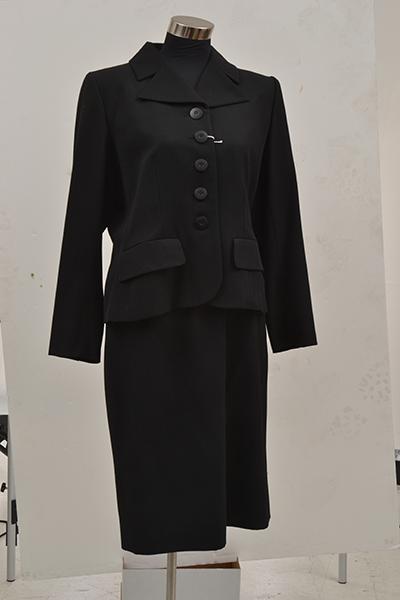 Appraisal: A BLACK SUIT BY YVES SAINT LAURENT A BLACK SUIT