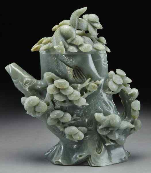 Appraisal: Chinese carved celadon jade tea potdepicting pine trees and squirrels