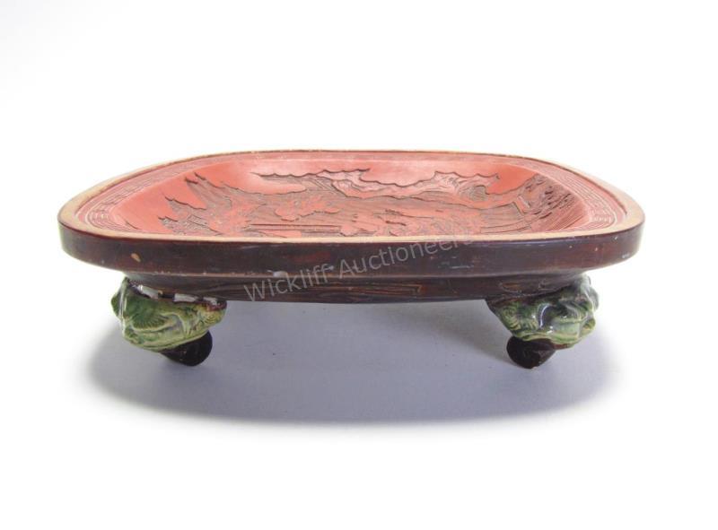 Appraisal: Chinese Carved Cinnabar Style Footed Bowl square bowl depicting family